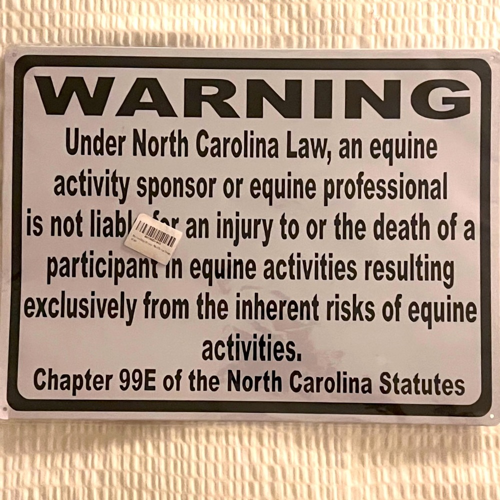 A metal sign defining equine (horse) waste abatement in South Carolina law
